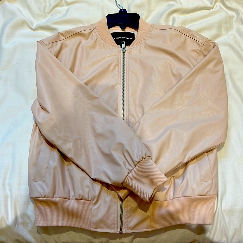 Pink jacket. Never worn. Tags taken off.
